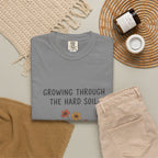 Grace in Progress Faith T-Shirt — Growing Through the Hard Soil — Vintage Terracotta Plant Christian Tee | Healing & Growth Design for Women