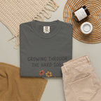 Grace in Progress Faith T-Shirt — Growing Through the Hard Soil — Vintage Terracotta Plant Christian Tee | Healing & Growth Design for Women