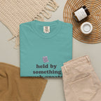 Grace in Progress Christian T-Shirt — Held by Something Much Greater — Vintage Hands & Wildflower Faith Tee | Prayer & Healing Shirt for Women