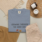 Grace in Progress Faith T-Shirt — Growing Through the Hard Soil — Vintage Terracotta Plant Christian Tee | Healing & Growth Design for Women